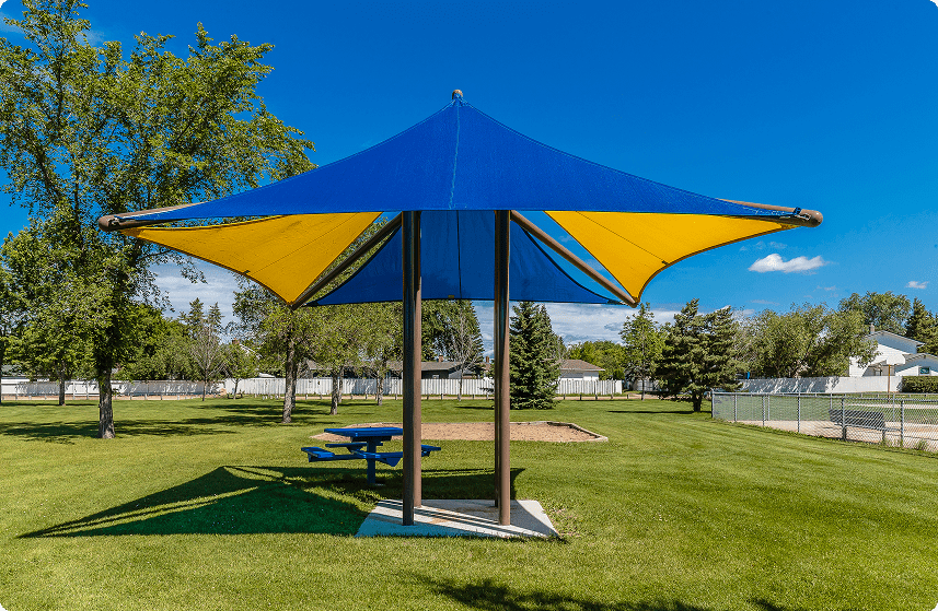 Picnic table under blue canopy