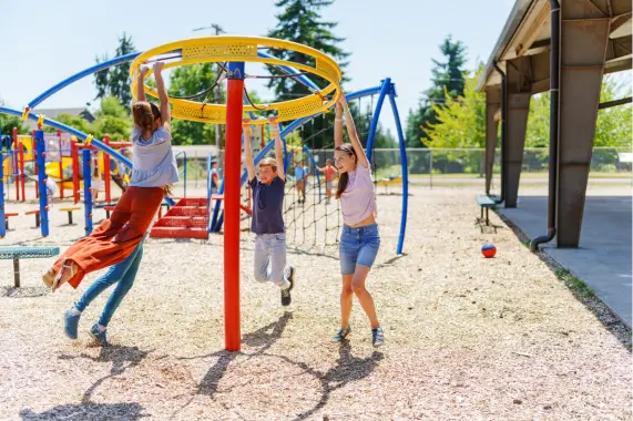 Three children enjoying a sunny day outside
